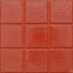 Bakla tanelerini andıran desenlere sahip kırmızı renkli tretuvar karoları.