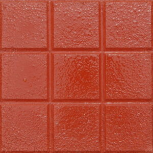 Bakla tanelerini andıran desenlere sahip kırmızı renkli tretuvar karoları.