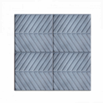 Belirgin eğimli çizgilere sahip gri renkli tretuvar karosu.